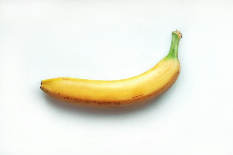 yellow banana on white surface