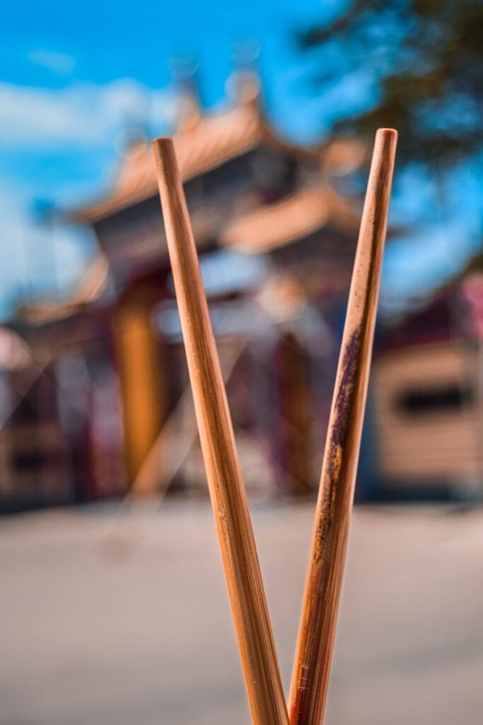 brown wooden sticks on grey concrete pavement