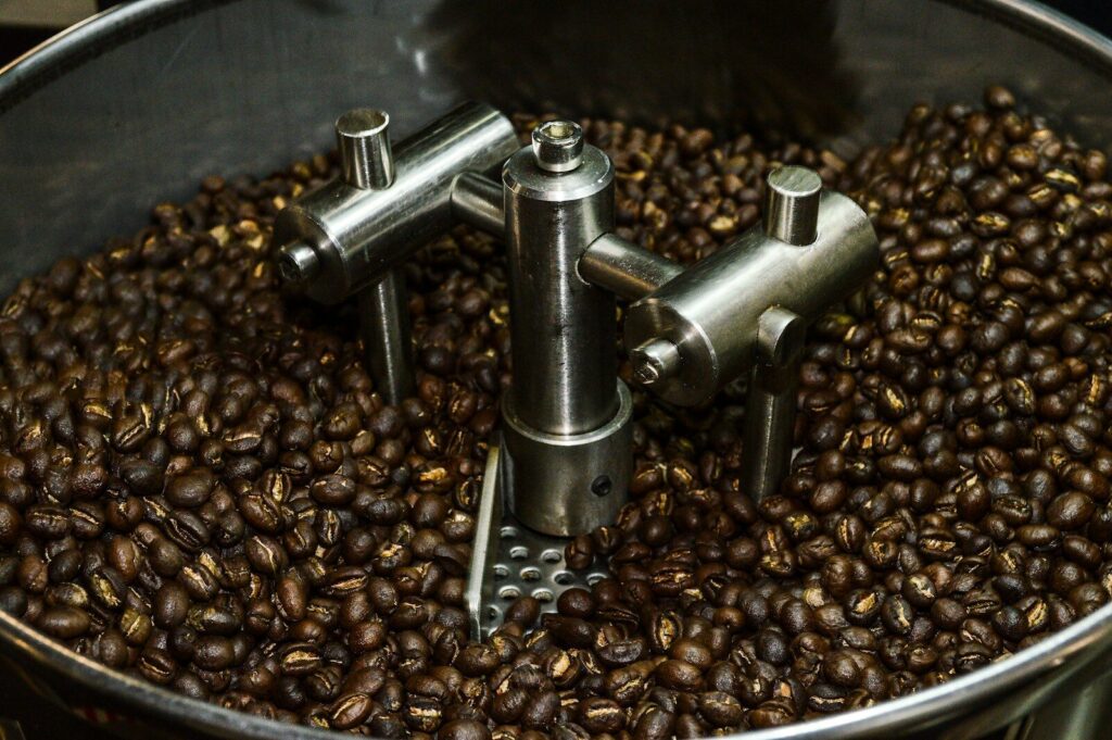 a large pot filled with lots of coffee beans